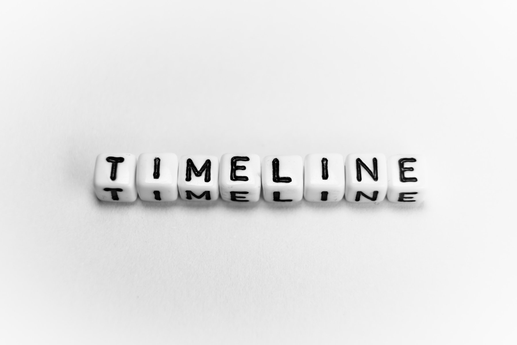 White cubes with word TIMELINE on white background